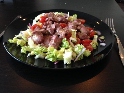Duck gizzards salad, with red onions and tomatoes
