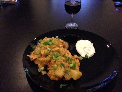 Harissa chicken with potatoes, red lentils, ginger and spring onions