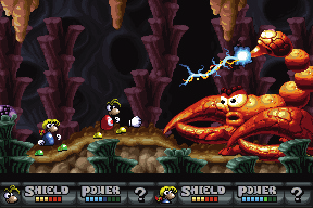 Rayman et le personnage jouable féminin de la même espèce que lui affrontant le scorpion géant sur lequel ils doivent prélever le nouveau cristal S.K.O.P.S. situé sur son aiguillon. Ce boss est une version géante du Scorpio de la capture d'écran précédente.