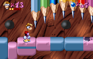 Rayman devant des crayons mobiles.