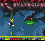 Rayman grimpant sur une liane dans Arcane Forest.