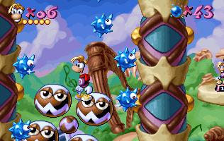 Rayman sur un tourniquet, entouré de boules piquantes.