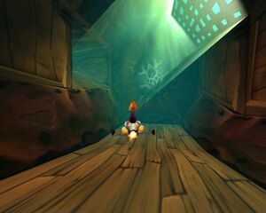 Rayman sur un obus à pattes gris dans le Vaisseau-Prison.