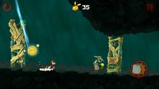 Rayman atterrissant à côté d'un Lividstone après un saut.