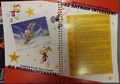 Le guide sur Rayman et sa carte postale.
