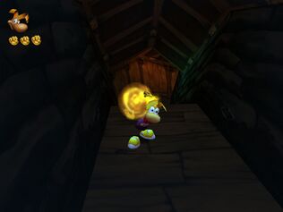 Rayman porte une sphère magique jaune dans le Sanctuaire d'Eau et de Glace.