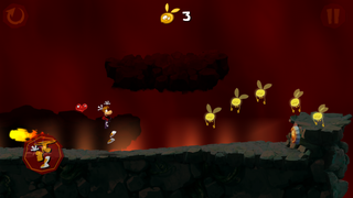 Rayman sautant au-dessus d'une boule de feu.