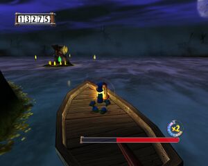 Rayman se sert d'une barque pour atteindre l'îlot.