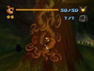 Rayman grimpant sur une liane dans la Clairière de la Fée.