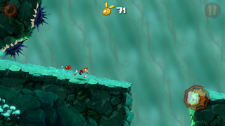 Un énorme rocher roulant derrière Rayman.