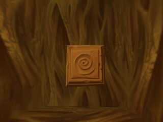 Une pierre de porte magique fixée à un mur dans Rayman Revolution.