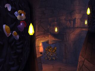 Rayman doit escalader ces murs pour éviter ces Knaarens.