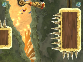 Rayman frappant un levier pour élever une plate-forme avec des pointes.