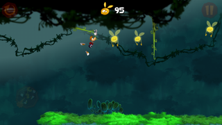 Rayman s'accrochant à des lianes.
