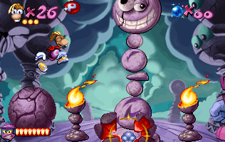 Rayman using the boulder to punch the stone head.