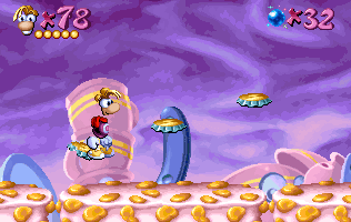Rayman standing on a slopey platform.