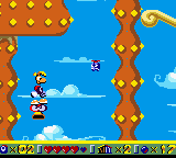 Rayman traveling upwards on a vertical trumpet.