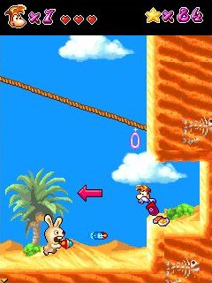 Rayman being attacked by a Rabbid.