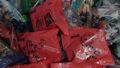 A lot of sealed bags, exclusively red coloured with the artwork of the corresponding toy inside