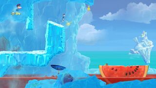 A watermelon floating atop a body of red water