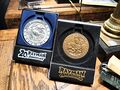 The Rayman Adventures medallion next to the aforementioned Rayman 20th anniversary medallion.