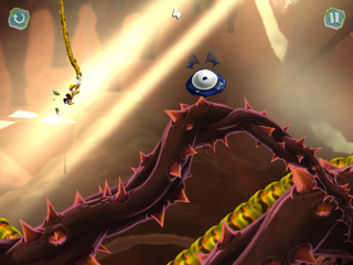Rayman grabbing onto a carnivorous liana to reach a caterpillar