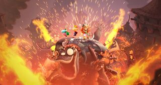 Rayman, Barbara and the Grand Minimus on a pile of defeated enemies.