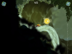 Rayman sliding towards a Skull Coin.
