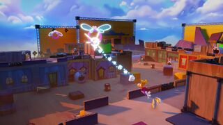 Rayman swinging from a flying ring during a battle